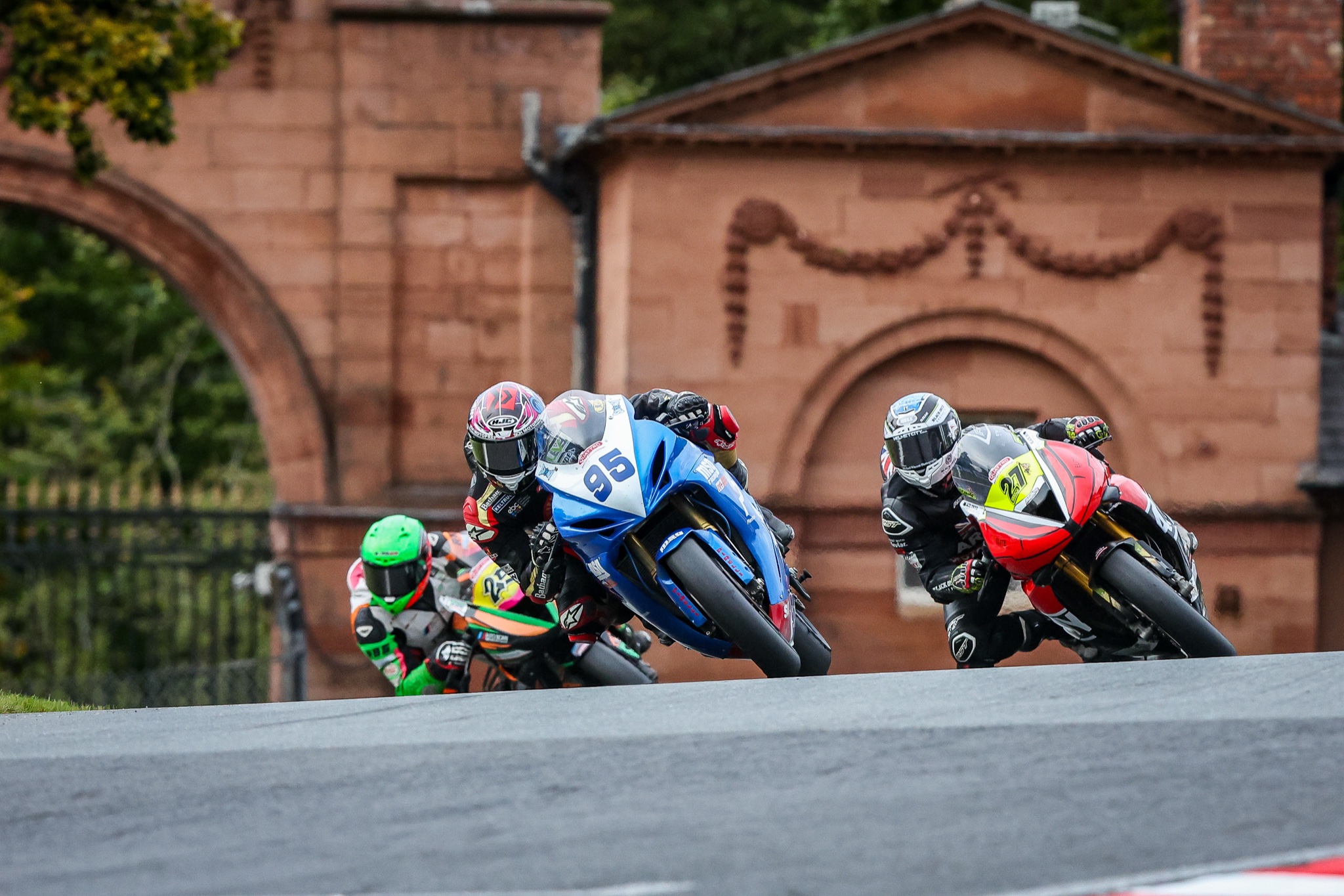 Christian Smith racing in a close pack through a fast section of track