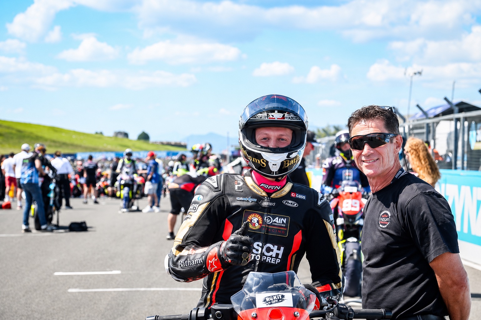 Christian Smith on the grid with a team member before a race