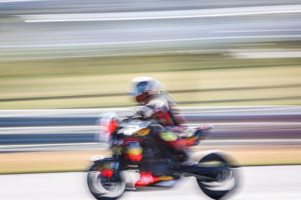 Kieran Smith riding at speed with motion blur on track