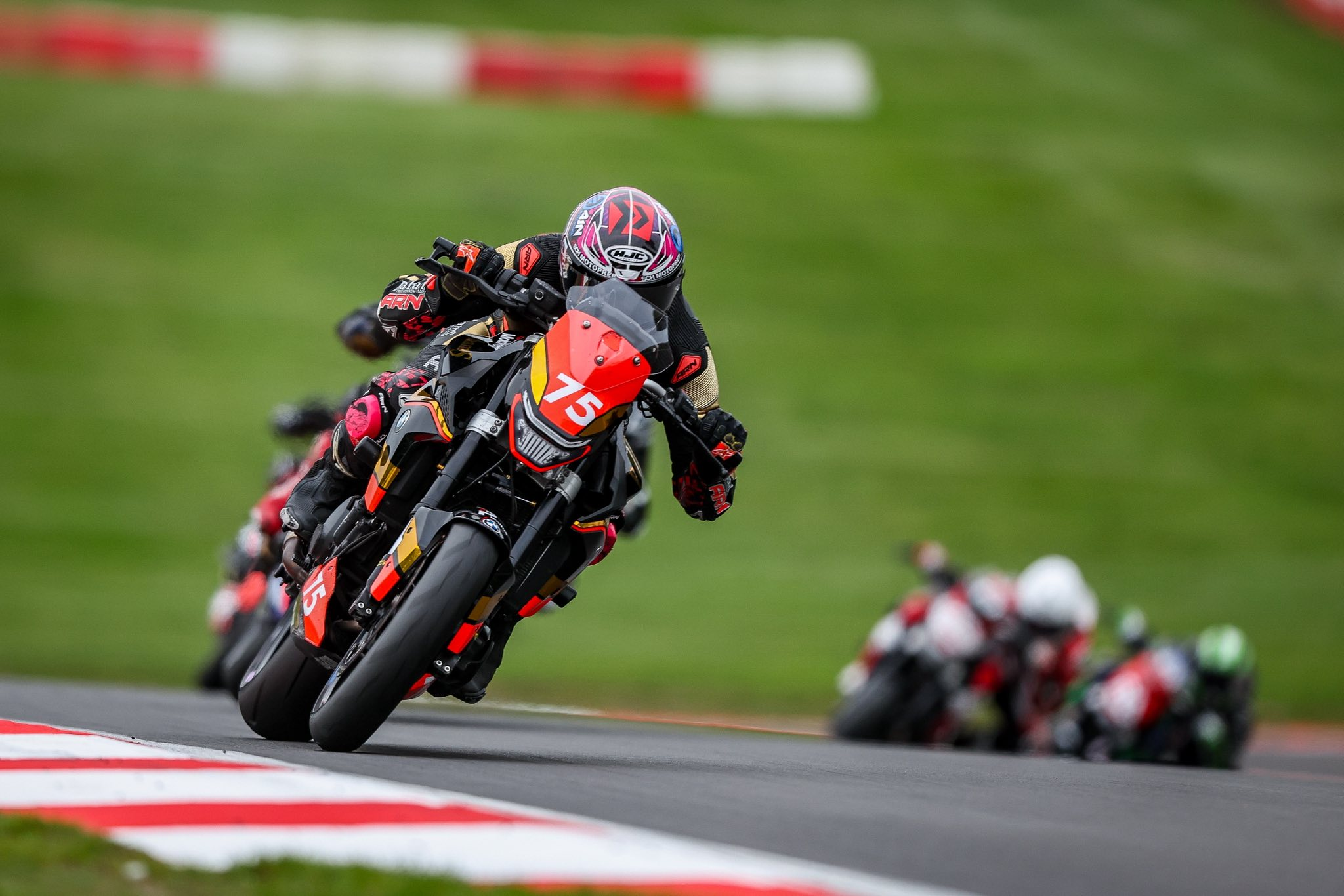Smith Twins rider leading a pack through Donington Park