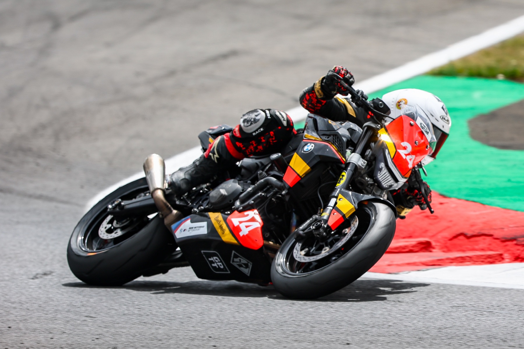 Kieran Smith leaning number 24 through a Snetterton corner
