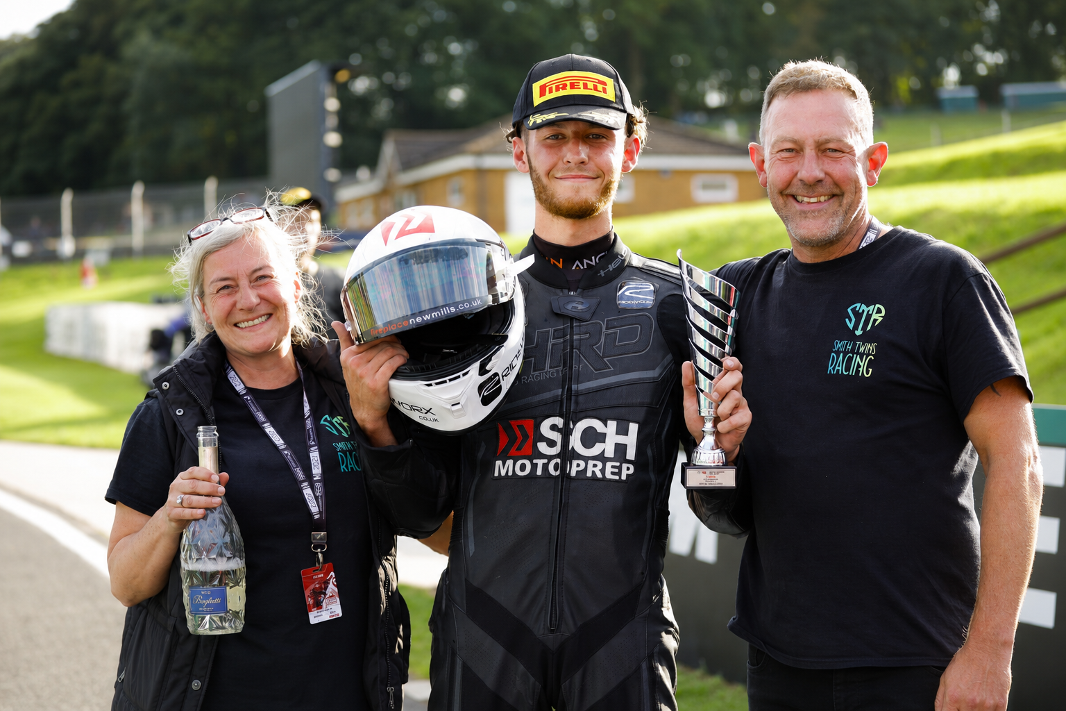 Rider holding a trophy with family